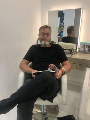 Marc is waiting in a good mood for his appointment at Mister A' - Hairdresser & Barber