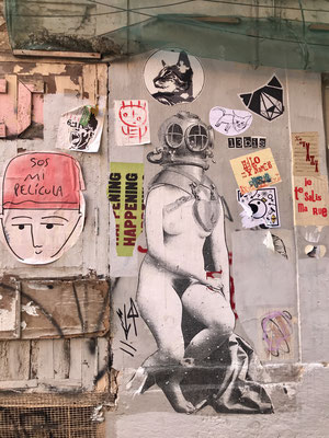 Graffiti of naked woman with historical diving helmet
