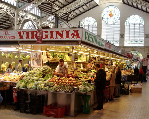 Fruit stall in Mercat Colón with art nouveau ceiling