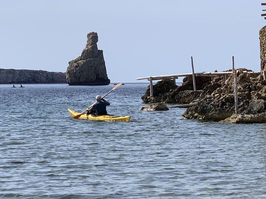 Canoeist in the bay of Benirrás, Ibiza