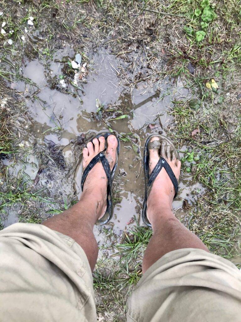 Marc gets his feet wet. The campsite in Pisa is flooded. 