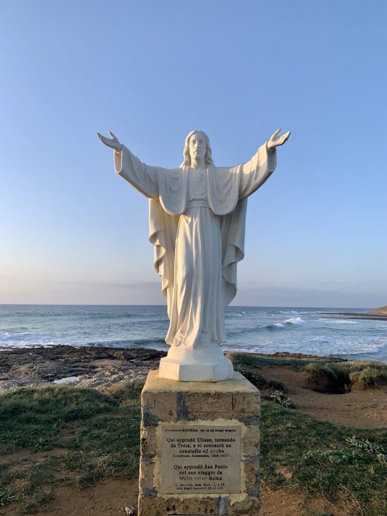 Christo statue in front of the Isola delle Correnti
